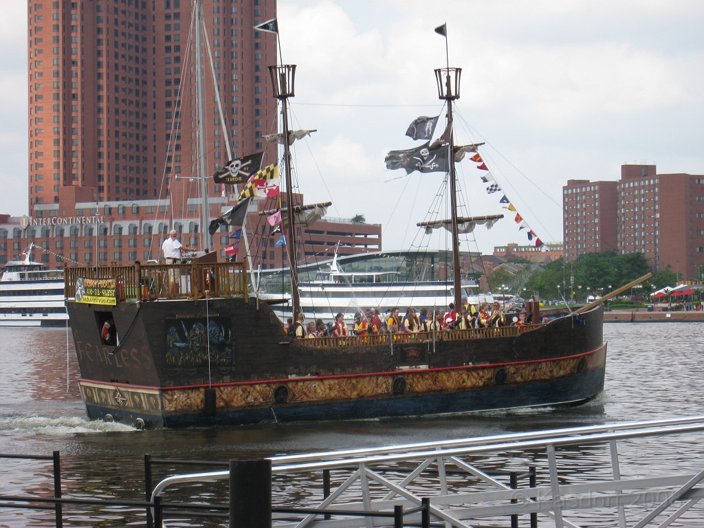 Baltimore MD 2009 0380.jpg - You can see the tour boat/attraction ride is packed with kids dressed as pirates! They sailed around the harbour a time or two then dropped them off for a new load... somebody came up with a money maker!